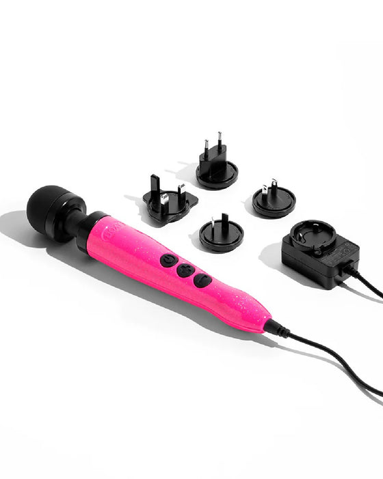 A pink Doxy Die Cast 3 Compact Wand Vibrator Hot Pink handheld electric massager with multiple interchangeable heads and a power cord, displayed on a white background.