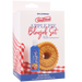 The Goodhead Apple Pie Blowjob Set with Stroker & Lube includes a bottle of lubricant, a ULTRASKYN textured stroker, and a donut-shaped toy. The box features a red gingham pattern along the bottom edge.