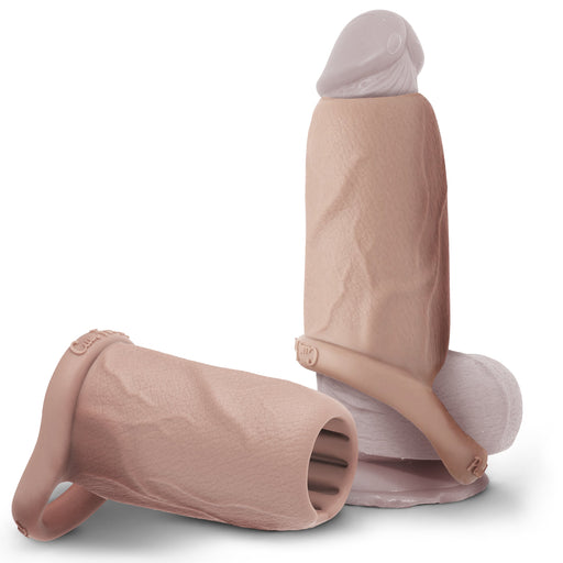 Two Girthy Pleasure Sleeves - Open-Ended Silicone Penis Sleeve (Size M) made of platinum silicone are shown: one upright over a white cylinder, the other on its side displaying the textured interior and attached base loop.