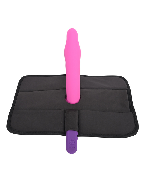 A pink Pivot 3 in 1 Play Pad Toy Mount standing upright on a black foldable mat against a white background, designed for pivot positioning as a hands-free sex toy.