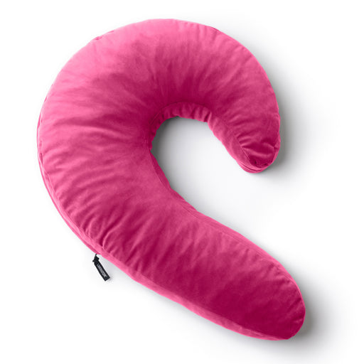 The Liberator Lune Snuggle Pillow with Vibrator Pocket is a bright pink, C-shaped body pillow with soft fabric, designed to support side sleepers. Shown on a white background.