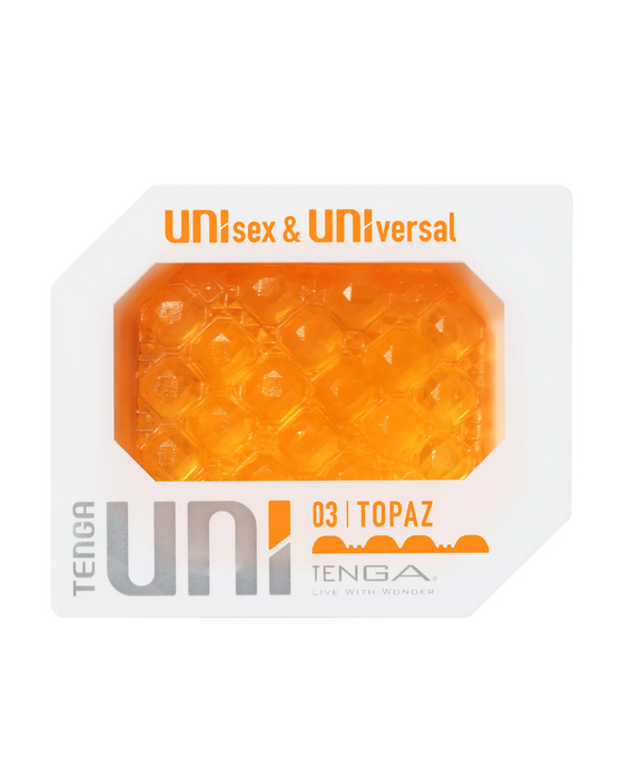 The image shows the packaging of a discreet masturbator from the Tenga Uni Topaz Textured Finger Sleeve series in a hexagonal shape with an orange, bubble-textured design. It features the labels "unisex & universal.