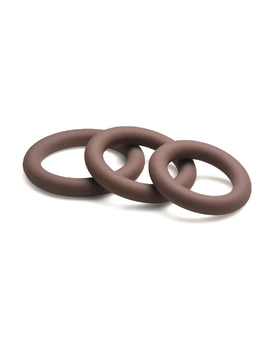 Three hypoallergenic chocolate brown circular rings of graduated sizes interconnected in a chain-like formation on a light background.
