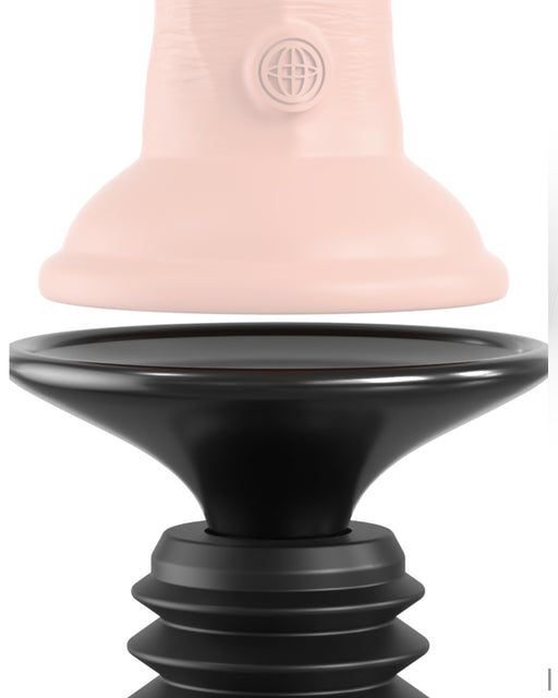 Close-up of a two-piece object, one part being a smooth, light pink featureless ring or cap with a globe logo, and the other part being a black, shaped base with ridged edges reminiscent of the Body Dock Thruster Powerful Thrusting Suction Cup Sex Toy Mount. The pieces are separated and aligned vertically facing each other.