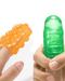 Two images of fingers wearing Tenga Uni Amethyst Textured Finger Sleeves for Stroking and Clit Massage, one orange and one green, made of stretchy material, against a white background.