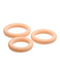 Three beige, circular Jock Discreet Silicone Cock Rings of graduated sizes arranged in a triangular formation on a white surface. (Brand Name: Curve Toys)