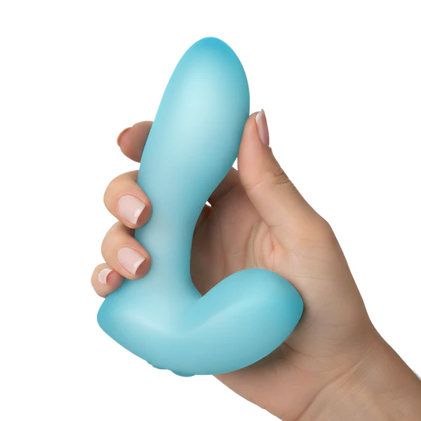 A hand with manicured nails holds the Softies Dual Stimulation G-Spot Beginner Vibrator, a blue silicone, waterproof vibe ideal for G-spot stimulation, against a white background.