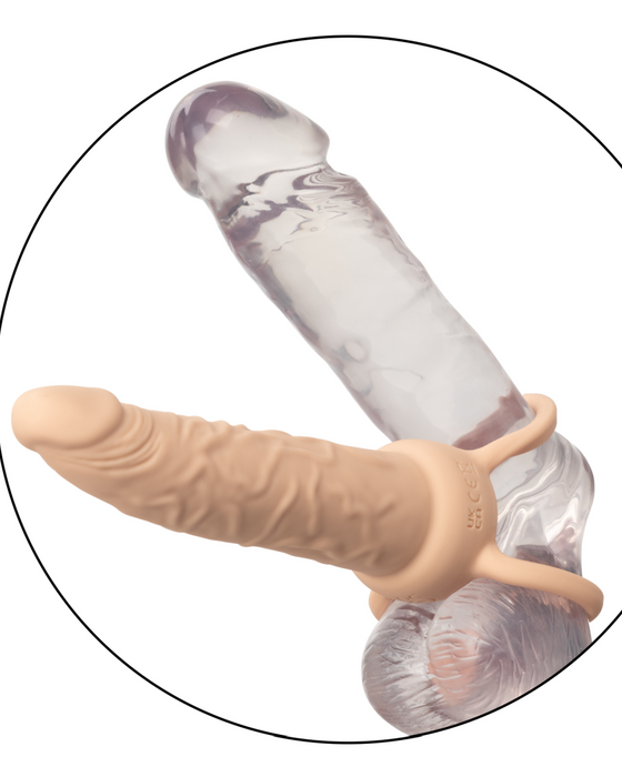 A clear and flesh-colored Performance Maxx Double Penetration Vibrating Dildo - Ivory designed for simultaneous double penetration, displayed on a white background within a black circular frame.