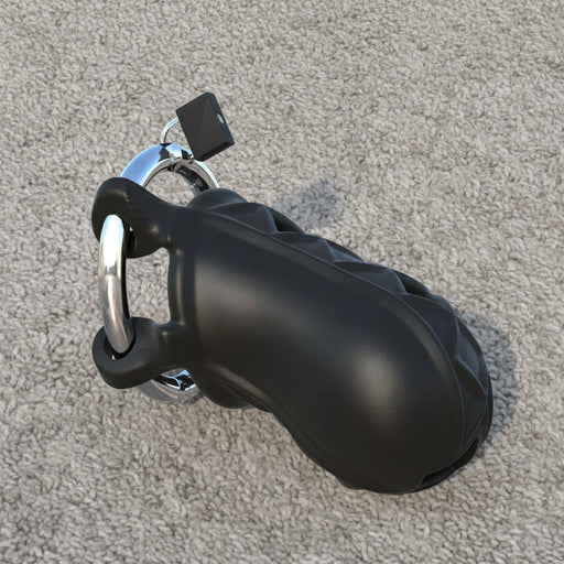 The Extreme Silicone Cock Blocker Locking Chastity Cage Black with a silver lock is set on a textured, light gray carpet.