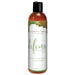 A 60ml (2oz) bottle of Intimate Earth Defense Anti-Bacterial Water Based Lubricant features a green and white label, black flip-top cap, and includes sea kelp, tea tree oil, guava bark, and carrageenan for added HPV protection.