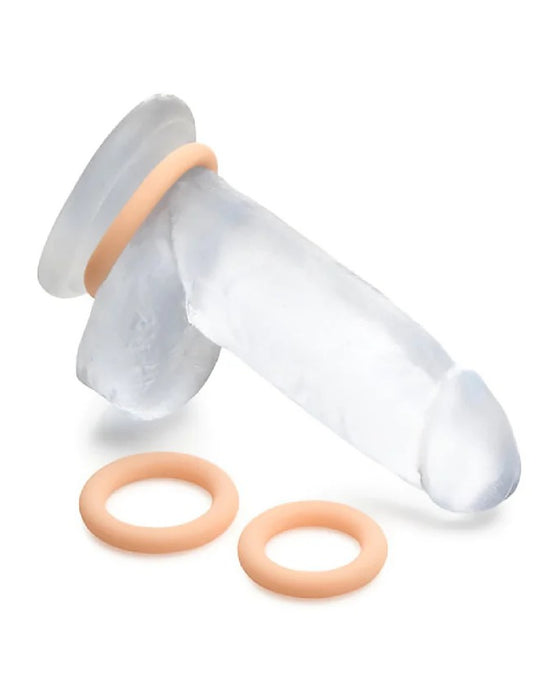 A transparent, hypoallergenic Curve Toys silicone finger stretcher with two orange resistance bands isolated on a white background.