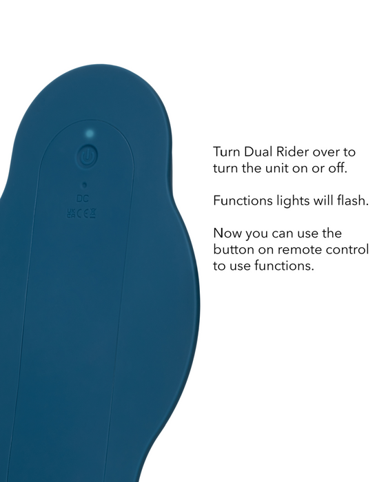 A blue electronic device with a power button and charging port. Instructions on the right say: "Turn CalExotics Dual Rider Remote Control Bump & Grind Humping Vibrator over to turn the unit on or off. Functions lights will flash. Now you can use the button on the remote control to use functions of this dual motor vibrator.