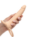 A hand holding a Performance Maxx Double Penetration Vibrating Dildo in Ivory by CalExotics, designed for anal exploration, against a white background.