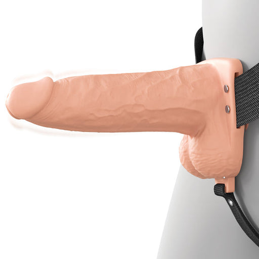 A person wearing the Fantasy X-Tensions Elite Vibrating Hollow 6 Inch Silicone Dildo & Strap-On Harness - Vanilla is shown against a plain white background.