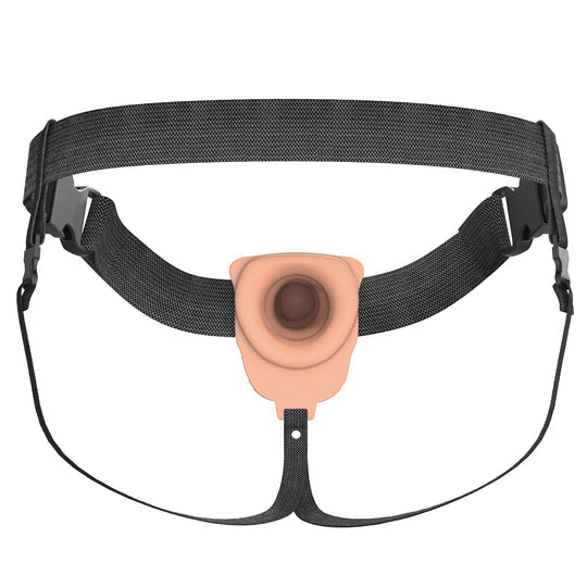 The Fantasy X-Tensions Elite Vibrating Hollow 6 Inch Silicone Dildo & Strap-On Harness - Vanilla features a black adjustable harness and a light beige vibrating hollow silicone dildo with a central circular opening for wearable use.