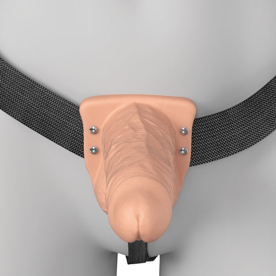 The Fantasy X-Tensions Elite Vibrating Hollow 6 Inch Silicone Dildo & Strap-On Harness - Vanilla is shown on a gray mannequin, featuring black adjustable waist and leg straps with a realistic vanilla-colored dildo.