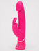 The Happy Rabbit Dual Density Rechargeable Silicone Rabbit Vibrator, featuring a bright pink phallic shape, curved shaft, and bunny ear external stimulator, stands upright against a plain white background.