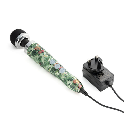 The Doxy Die Cast 3 Compact Wand Vibrator Pineapple Pattern features a black rounded head, silver accents, control buttons for deep rumbles, and connects to a black power adapter with UK plug.