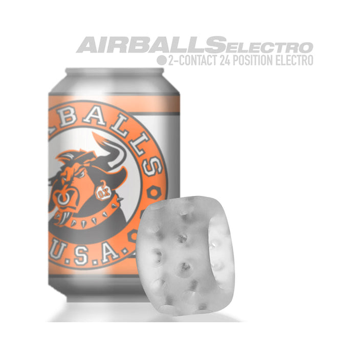 A silver can with an orange and white label featuring a bull logo stands behind a translucent, textured Oxballs Ball Stretcher or Penetration Bumper with holes. Above both items are the words "AIRBALLS ELECTRO".