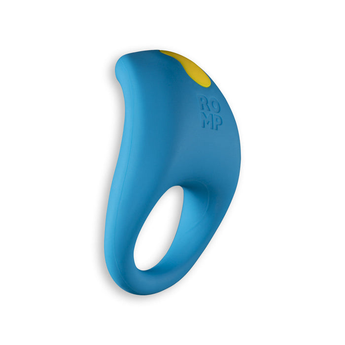 The Romp Juke Silicone Vibrating Couples Cock Ring is a blue, waterproof silicone ring with a looped handle, yellow button on top, and “ROMP” embossed on the side, designed for style and function, shown against a white background.