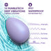The Serene Silicone Waterproof Palm Vibrator, an oval purple massager, floats on blue water. Featuring 10 RumbleTech modes, 5 speeds and patterns, platinum-cured silicone construction, and IPX7 waterproof for soothing relief.