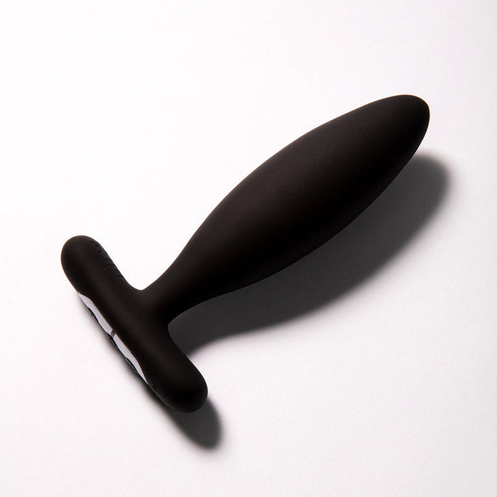 The Je Joue Vesta Petite Powerful Remote Control Vibrating Butt Plug, made from body-safe silicone with a smooth tapered design and flared base, is shown resting on a white surface.