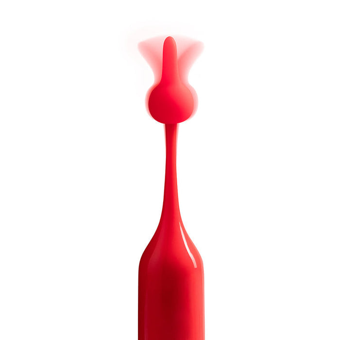 A splash of bright red liquid forms a smooth, tall column with a curved top, evoking the sleek design of the Romp Pop Pinpoint Clitoral Stimulator with 2 Heads, all set against a plain white background.