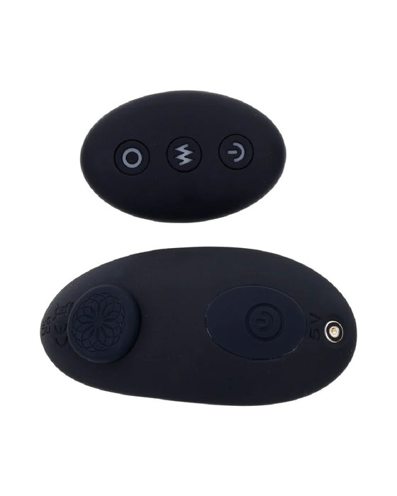 Two small, black, oval-shaped remote controls for a Sportsheets Hidden Pocket Strap On With Remote Control Vibrator with minimal button designs isolated against a white background.