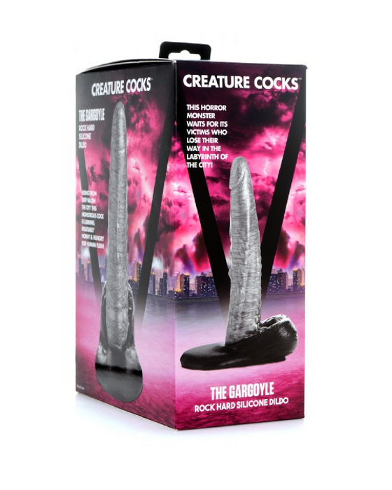 A product package for "The Gargoyle Rock Hard 9 Inch Silicone Fantasy Dildo" by XR Brands featuring a design resembling a stone-textured dildo shaped like a mythical creature's leg, complete with a suction cup base, against a backdrop of neon pink skyscrapers.