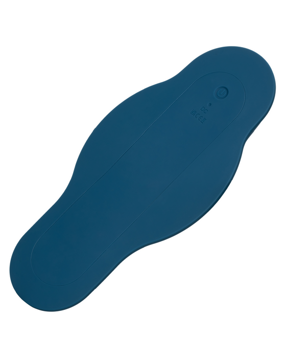 A blue, oval-shaped, flexible pad with smooth edges. The pad features a small, circular button near one end and text indicating power and regulatory information. The design suggests it could be part of the CalExotics Dual Rider Remote Control Bump & Grind Humping Vibrator or other electronic device.