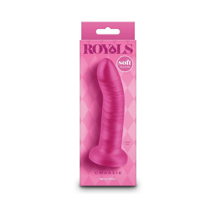 A metallic pink 5-inch silicone dildo named "Charlie," with a defined head, veined texture, and strong suction cup base, stands upright in its matching "Royals" box labeled "Charlie 5 inch Small Silicone Dildo - Metallic Pink.