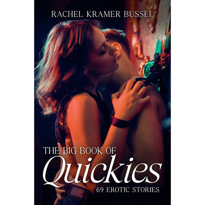 A woman in lingerie kisses a man’s neck by a dimly lit wall. "The Big Book of Quickies: 69 Erotic Stories" offers sizzling, short erotic tales sure to ignite passion.