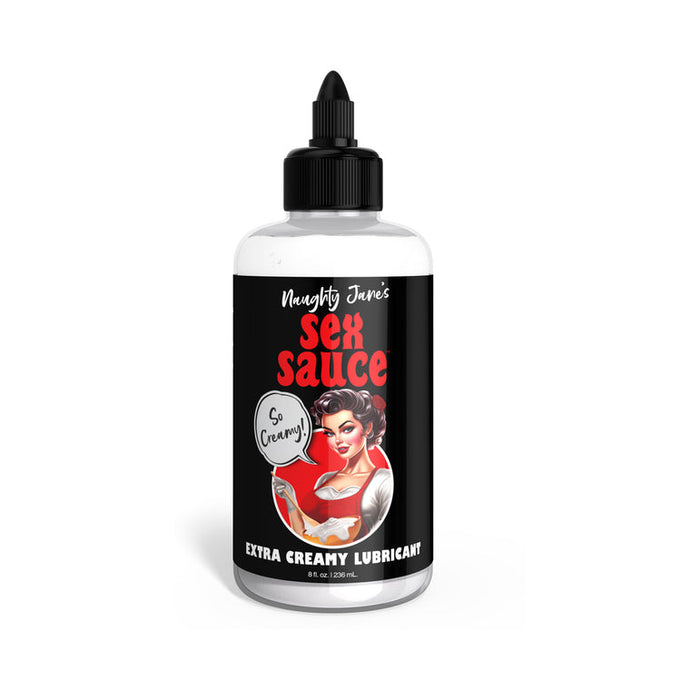 A bottle of Squirting Strap-On Set cum lube with a retro-style woman illustration and "So Creamy!" text—ideal for pairing with the included light tone silicone dildo and harness. The bottle has a black label and cap.