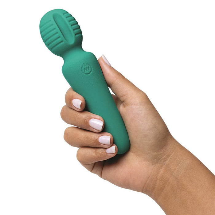 A hand with light skin holds the Petite Private Pleasure Waterproof Silicone Wand Vibrator, made of silky-smooth silicone with a ribbed, rounded head—an ideal choice for beginners.