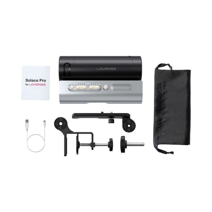 Lovense Solace Pro AI Powered Thrusting Masturbator with Remote Control kit displayed on a white background, including the hands-free stroker, instruction manual, USB cable, mounting parts, and a black storage pouch.