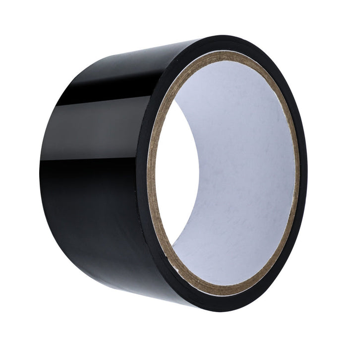 A roll of shiny black adhesive tape from the Midnight Moods 10 Piece Beginner Bondage Kit, ideal for pairing with a bondage set, displayed on a white background.