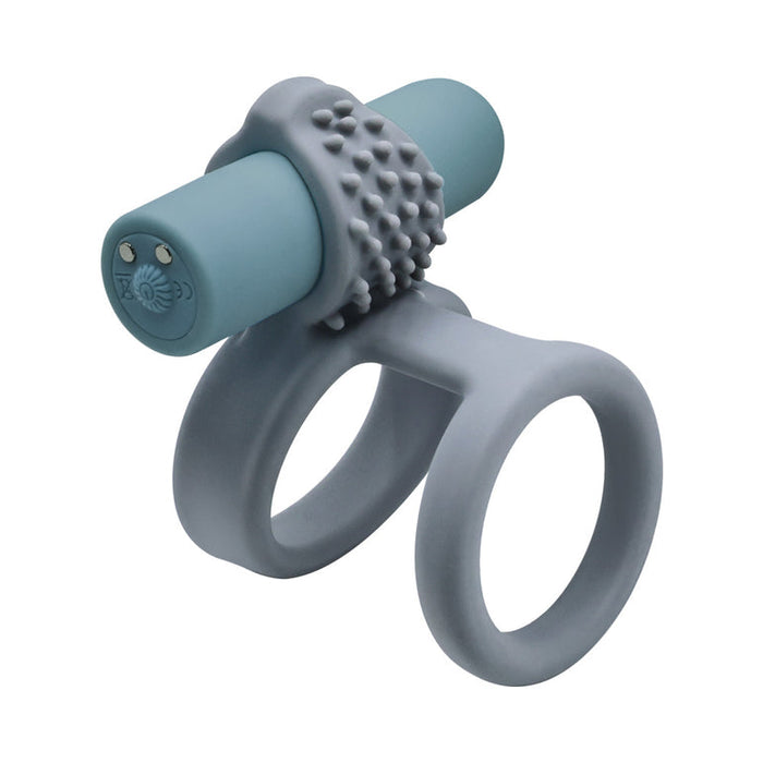 The Rockin' Rumbler Vibrating Penis Enhancers Set of 3 features gray silicone rings with textured nubs and two loops, plus a removable blue rechargeable bullet vibrator for couples’ enhanced stimulation.