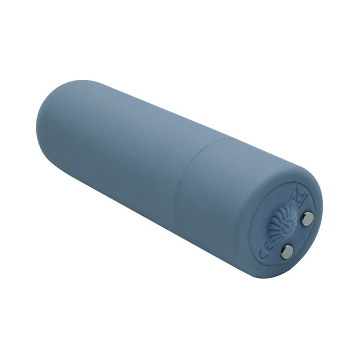 A small, blue, cylindrical device with rounded ends and two metal contacts—likely a rechargeable bullet from the Rockin' Rumbler Vibrating Penis Enhancers Set of 3.