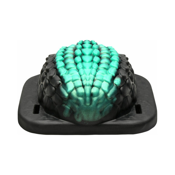 The Dragon Grinder - Vibrating Silicone Fantasy Pad is a green and black reptile-shaped vibrator that features fantasy-inspired design, is waterproof, and rechargeable.