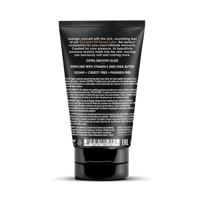 A black tube of Wicked Coconut Oil Based Lubricant - 4 oz stands upright, showing its back label with white text listing ingredients, usage instructions, and benefits like vitamin E and shea butter for gentle intimate care.