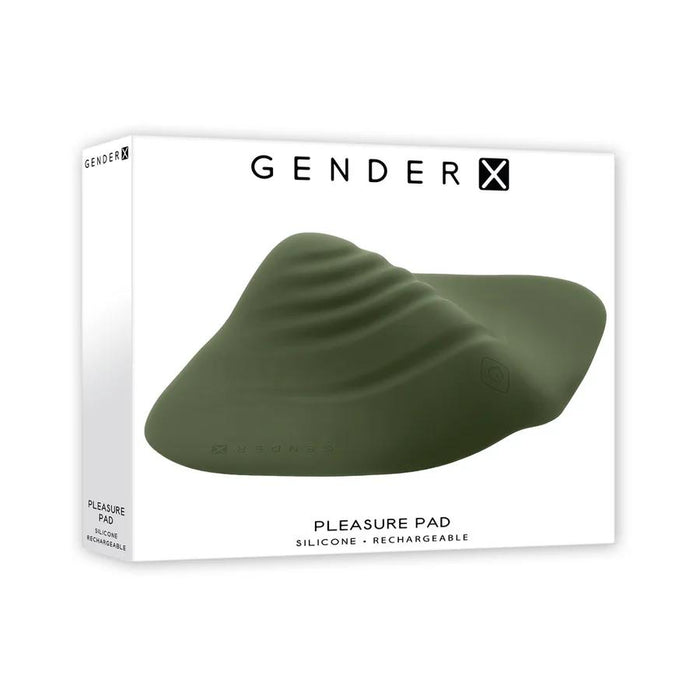 A white box with "GENDER X" branding showcases the Gender X Pleasure Pad Rechargeable Grinding Pad & Stroker, a green, ridged, waterproof pad crafted from flexible silicone. The box reads "Pleasure Pad" and "Silicone. Rechargeable.