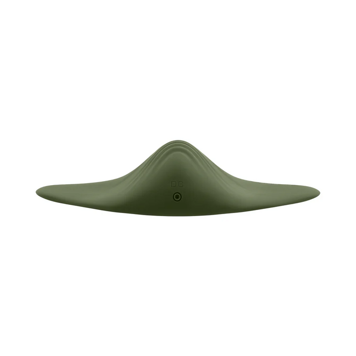 The Gender X Pleasure Pad Rechargeable Grinding Pad & Stroker is a green, smooth, curved device shaped like a stealth aircraft or manta ray, shown front-on against a white background with a “DC” button below the center ridge.