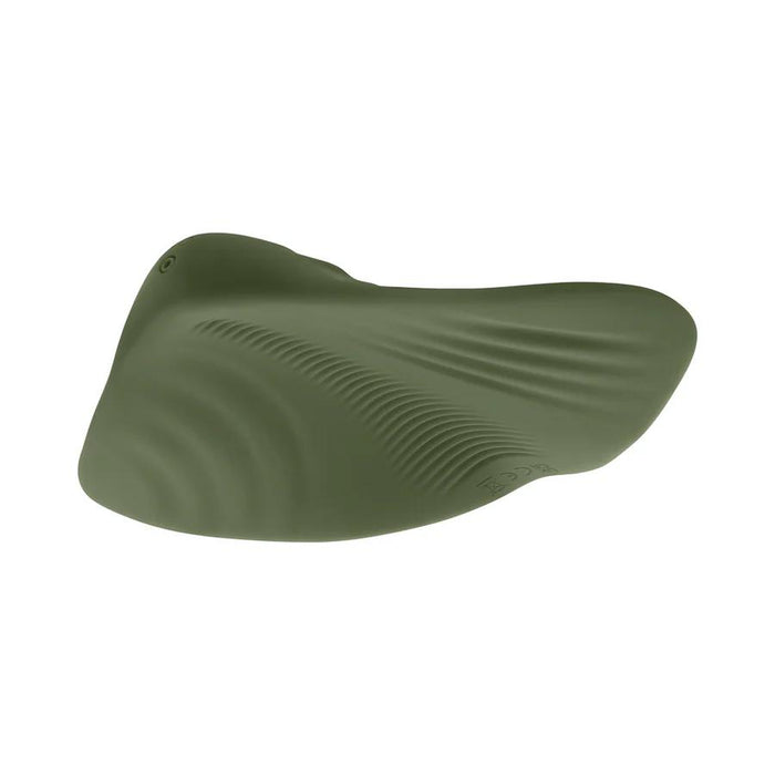 A green Gender X Pleasure Pad Rechargeable Grinding Pad & Stroker made of flexible silicone with smooth, wavy ridges and a small button, shown on a white background.