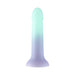 The Ombre Curve Liquid Silicone 6 Inch Slim Dildo features a realistic shape, fades from light teal to pale lavender, and stands upright on a flat suction cup base for G-Spot stimulation against a white background.