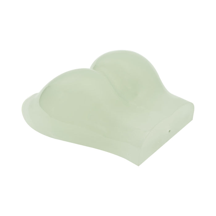 The Glow-in-the-Dark Peek-A-Booty Masturbator is a light green, contoured foam cushion with two rounded, elevated sections for ergonomic support and a lifelike experience.