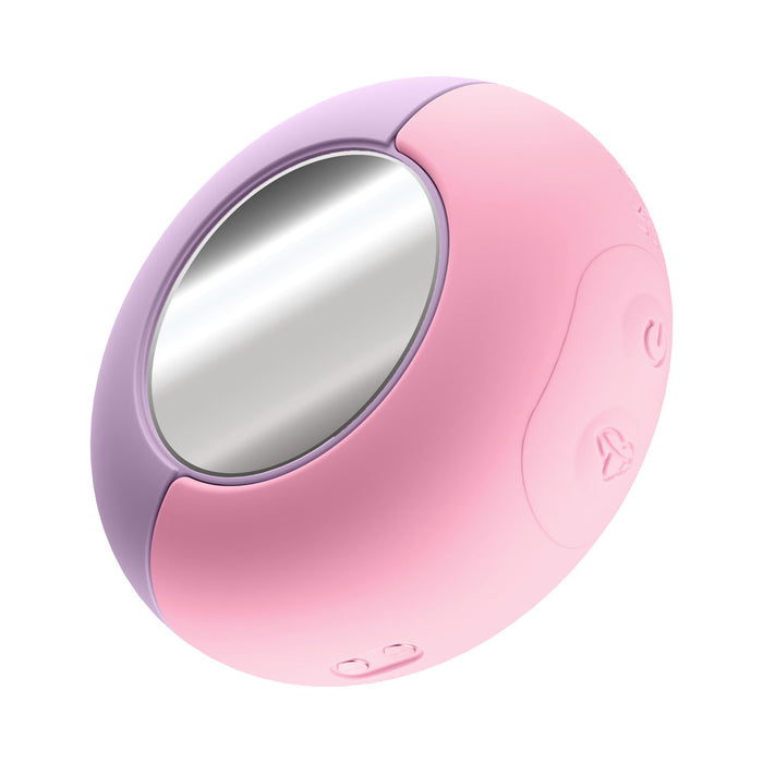 The Pout & Play Double Ended Vibrator with Licking Tongue is a discreet pink and lavender oval-shaped beauty case featuring a central reflective surface and several raised buttons on its side.
