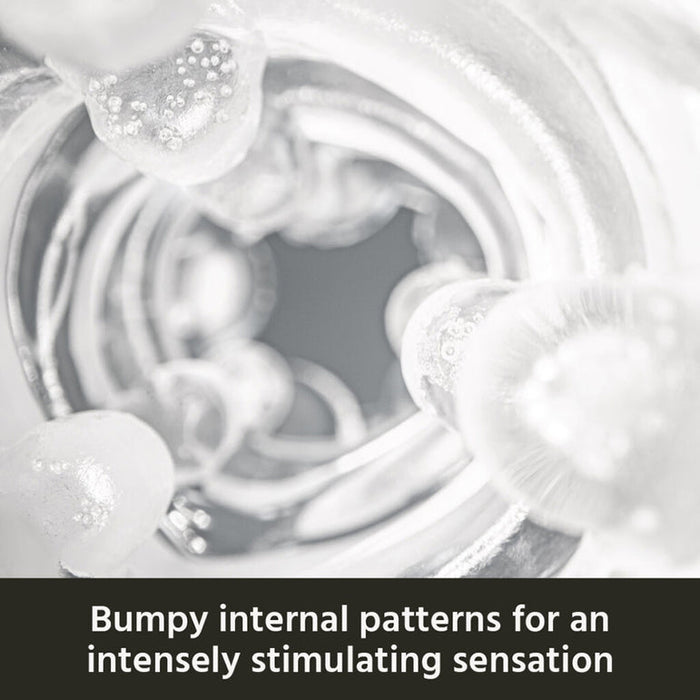 Close-up of The Handy Dream Collection Touch Sleeve’s translucent, bumpy interior. Text below: "Bumpy internal patterns and targeted stimulation for an intensely stimulating sensation.
