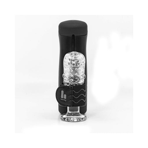 The Handy TrueGrip Pro Band is a black cylindrical electronic device with a transparent textured sleeve and a black strap displaying the white TrueGrip Pro Band logo, all shown upright against a white background.