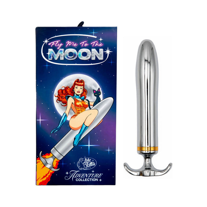 The Fly Me To The Moon Metal Vibrator, a silver metallic waterproof toy, is pictured next to its colorful box with retro artwork of a woman riding a rocket and the words "Fly Me To The MOON" and "Adventure Collection.
