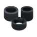 Three black silicone cock rings from the Accelerate Thick Stretchy Cock Rings Set of 3, each wide-holed and cylindrical, are arranged closely together on a white background.